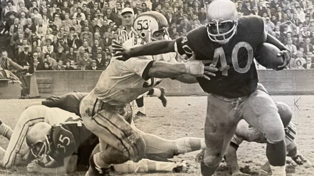 Donnie Moore runs against Ohio State in 1965.