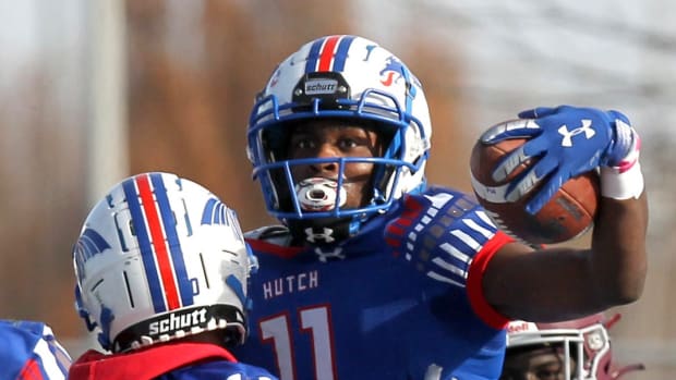 Hutchinson's Malik Benson (11) celebrates after hauling in a Hail Mary touchdown with Cortez Braham (1) and Demariyon Houston (10) during the Salt City Bowl against Hinds Community College Saturday, Dec. 4, 2021, at Gowans Stadium.