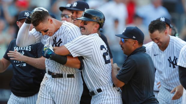 New York Yankees right fielder Aaron Judge (99) celebrates with New York Yankees second baseman Matt Carpenter (24) after hitting a game-winning home run against the Houston Astros during the 10th inning of a baseball game, Sunday, June 26, 2022, in New York. The New York Yankees won 6-3.