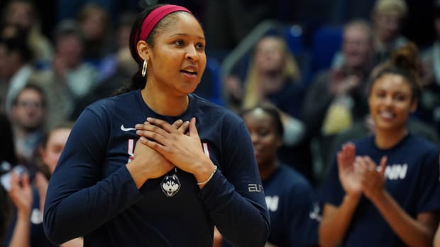 Former UConn Huskies player Maya Moore is honored before the game against the UConn Huskies and 2020 USA Womens National Team at XL Center.