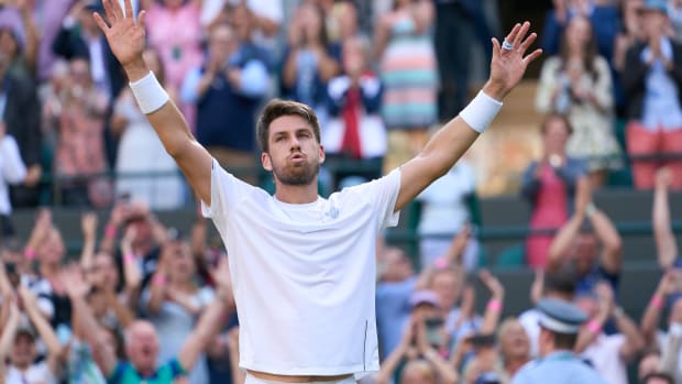 Jul 5, 2022; London, England, United Kingdom; Cameron Norrie (GBR) celebrates after match point against David Goffin (BEL) in a quarterfinals mens singles match on Number One court at the 2022 Wimbledon Championships at All England Lawn Tennis and Croquet Club.