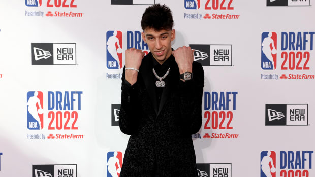 Chet Holmgren poses on the red carpet at the NBA draft