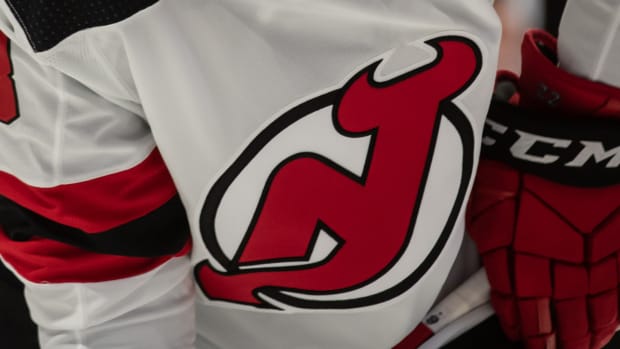 A close-up view of New Jersey Devils defenseman Reilly Walsh’s jersey.