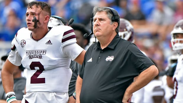 Sep 18, 2021; Memphis, Tennessee, USA; Mississippi State Bulldogs quarterback Will Rogers (2) and head coach Mike Leach (right) look on during the first half against the Memphis Tigers at Liberty Bowl Memorial Stadium. Mandatory Credit: Justin Ford-USA TODAY Sports