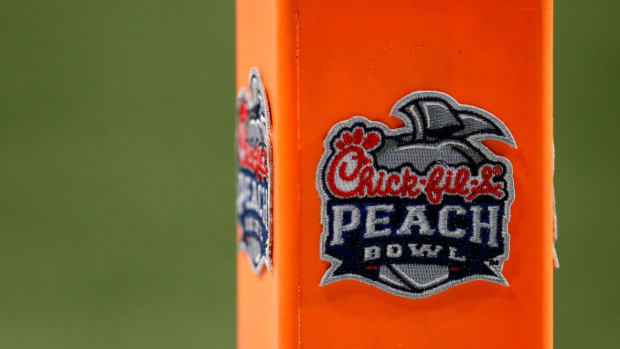 Pylons carry the Peach Bowl logo in the end zone.