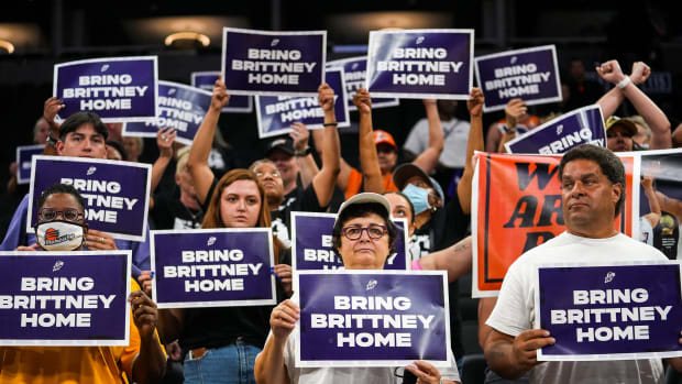 Attendees lift up their signs during a rally for Brittney Griner’s release at the Footprint Center on July 6, 2022, in Phoenix.