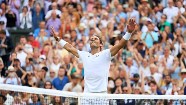 Rafael Nadal of Spain celebrates after winning the men's singles quarterfinal match against Taylor Fritz of the United States at Wimbledon.