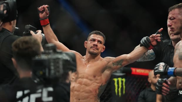 Mar 5, 2022; Las Vegas, Nevada, UNITED STATES; Rafael Dos Anjos celebrates after defeating Renato Moicano (not pictured) during UFC 272 at T-Mobile Arena.