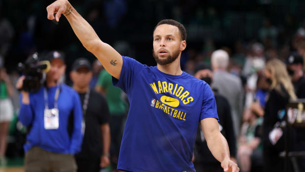 Stephen Curry shoots a practice jumper during pregame warmups.