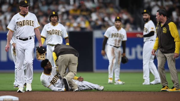 Padres outfielder Jurickson Profar collapses after collision.