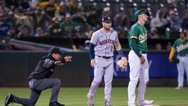 Jul 8, 2022; Oakland, California, USA; Oakland Athletics catcher Sean Murphy (12) reacts after advancing to third base against Houston Astros third baseman Alex Bregman (2) during the seventh inning at RingCentral Coliseum. Mandatory Credit: Neville E. Guard-USA TODAY Sports
