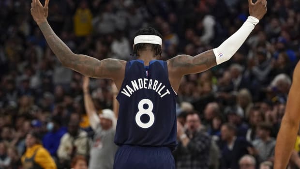 Minnesota Timberwolves forward Jarred Vanderbilt (8) reacts with the crowd against the Los Angeles Lakers during the second quarter at Target Center.