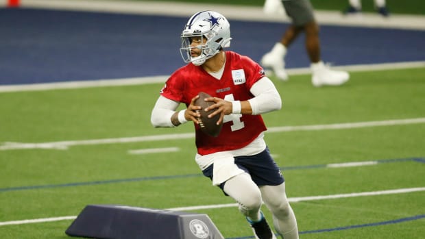 Jun 14, 2022; Arlington, Texas, USA; Dallas Cowboys quarterback Dak Prescott (4) goes through drills during minicamp at the Ford Center at the Star Training Facility in Frisco, Texas.