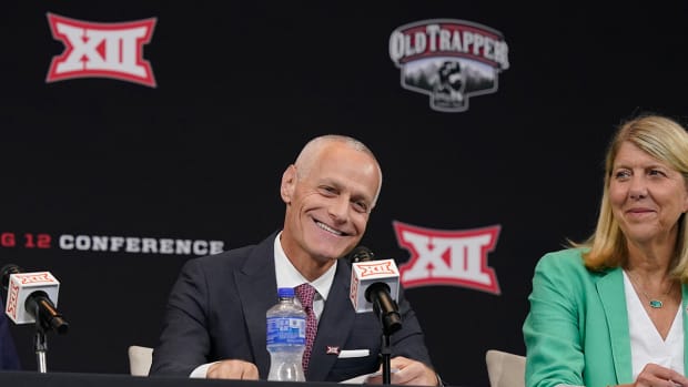 Incoming Big 12 commissioner Brett Yormark smiles during a news conference opening the NCAA college football Big 12 media days in Arlington, Texas.