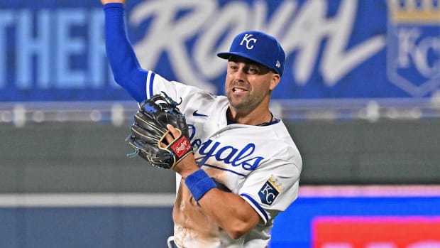 Kansas City Royals second baseman Whit Merrifield (15) turns to make a throw to first base during the sixth inning against the Texas Rangers at Kauffman Stadium.