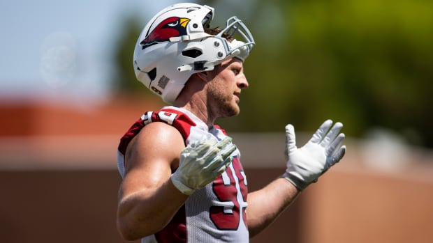 Cardinals defensive end J.J. Watt (99) hold his hands up during OTA workouts at the team’s training facility.