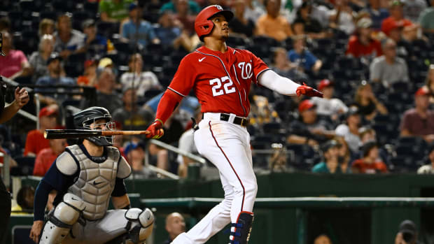 Nationals right fielder Juan Soto (22) watches his solo home run against the Mariners during the ninth inning of a game at Nationals Park.