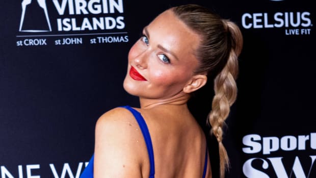 American model Camille Kostek arrives at the Sports Illustrated Swimsuit Launch Celebration of the 2022 Issue.