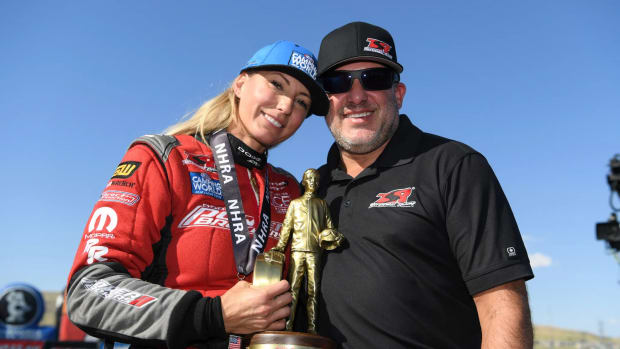 Leah Pruett and husband, NASCAR legend Tony Stewart, celebrate her win earlier this year in the NHRA Mile-High Nationals near Denver. Photo courtesy NHRA.