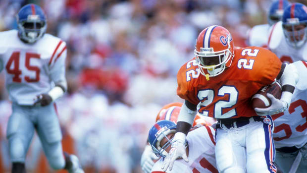 Running back Emmitt Smith #22 of the Florida Gators runs with the ball during a game against the Ole Miss Rebels at Ben Hill Griffin Stadium on September 9,1989 in Gainsville, Florida.