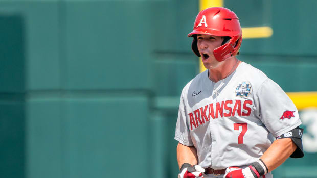 Jun 18, 2022; Omaha, NE, USA; Arkansas Razorbacks third baseman Cayden Wallace (7) celebrates after hitting a double during the seventh inning against the Stanford Cardinal at Charles Schwab Field. Mandatory Credit: Dylan Widger-USA TODAY Sports