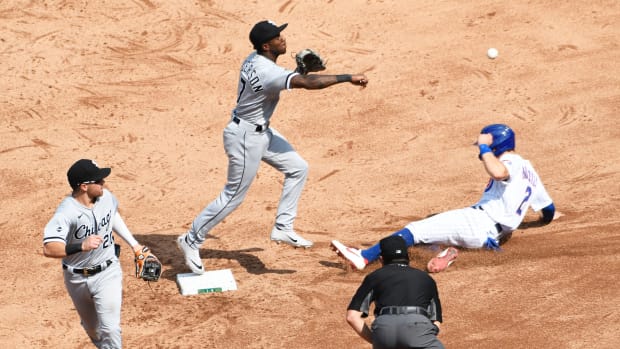 White Sox shortstop Tim Anderson forces out Cubs Nico Hoerner while trying to turn double play