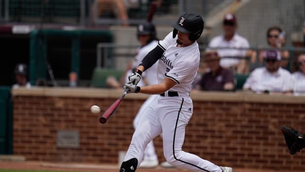 Jun 11, 2022; College Station, TX, USA; Louisville outfielder Levi Usher (5) hits a single in the first innning against Texas A&M at Blue Bell Park. Mandatory Credit: Chris Jones-USA TODAY Sports