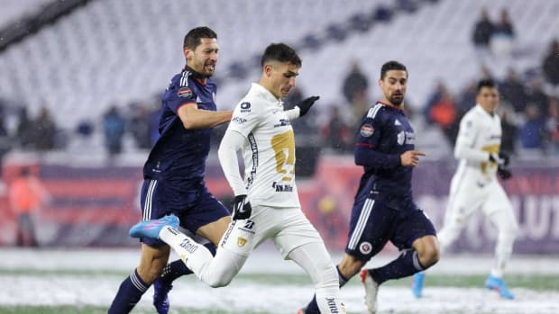 Mar 9, 2022; Foxborough, Massachusetts, USA; Pumas UNAM forward Juan Ignacio Dinenno (9) shoots the ball defended by New England Revolution defender Omar Gonzalez (3) during the first half at Gillette Stadium. Mandatory Credit: Paul Rutherford-USA TODAY Sports