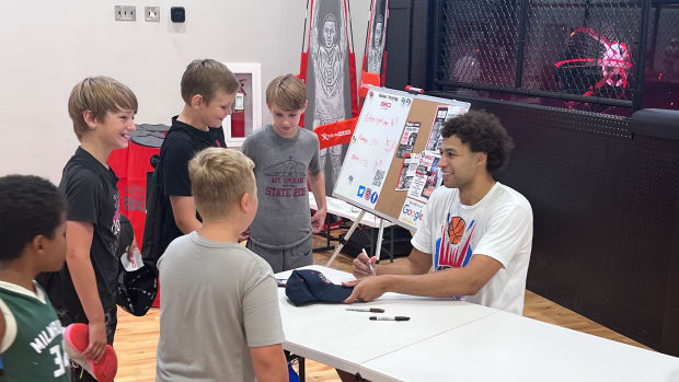 On the last day of camp, Anton Watson spent time taking pictures with his campers and signing autographs.