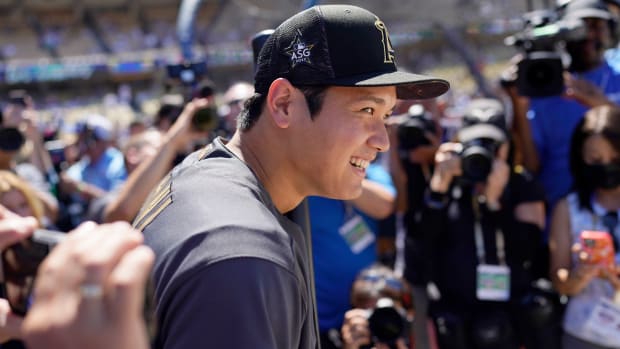 Shohei Ohtani, of the Los Angeles Angels, smiles during batting practice before the MLB All-Star baseball game against the American League, Tuesday, July 19, 2022, in Los Angeles.