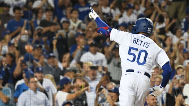 Jul 21, 2022; Los Angeles, California, USA; Los Angeles Dodgers right fielder Mookie Betts (50) celebrates hitting a three run home run in the eighth inning against the San Francisco Giants at Dodger Stadium. Mandatory Credit: Richard Mackson-USA TODAY Sports