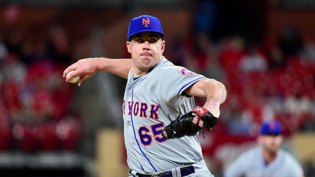 Apr 25, 2022; St. Louis, Missouri, USA; New York Mets relief pitcher Trevor May (65) pitches against the St. Louis Cardinals during the eighth inning at Busch Stadium.