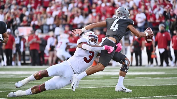 Washington State Cougars quarterback Jayden de Laura (4) is caught by Stanford Cardinal linebacker Levani Damuni (3) in the first half at Gesa Field at Martin Stadium. Jayden would be called for intentional grounding on this play.