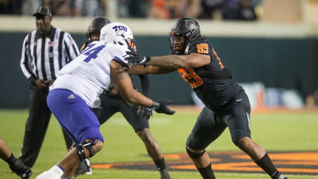 Nov 13, 2021; Stillwater, Oklahoma, USA; TCU Horned Frogs offensive tackle Andrew Coker (74) blocks Oklahoma State Cowboys defensive end Tyler Lacy (89) during the third quarter at Boone Pickens Stadium. OSU won 63-17.