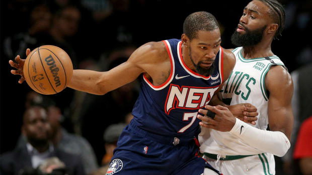 Apr 25, 2022; Brooklyn, New York, USA; Brooklyn Nets forward Kevin Durant (7) controls the ball against Boston Celtics guard Jaylen Brown (7) during the fourth quarter of game four of the first round of the 2022 NBA playoffs at Barclays Center. The Celtics defeated the Nets 116-112 to win the best of seven series 4-0.