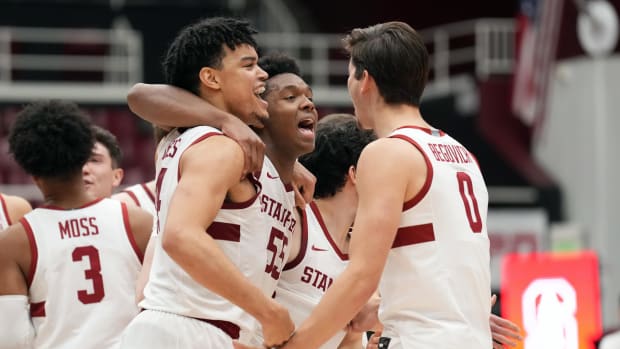 Stanford Cardinal forward Harrison Ingram (55) celebrates with forwards Spencer Jones (14) and Neal Begovich (0) after the game against the USC Trojans at Maples Pavilion.