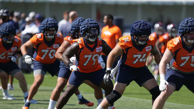 Denver Broncos center Lloyd Cushenberry III (79) and tackle Casey Tucker (74) during training camp at the UCHealth Training Center.