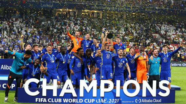 Chelsea players celebrate with the FIFA Club World Cup trophy