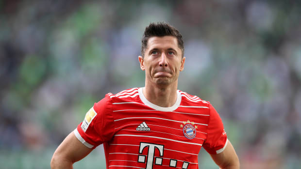 Robert Lewandowski pictured looking emotional as he stands in front of Bayern Munich's fans after the club's final game of the 2021/22 season
