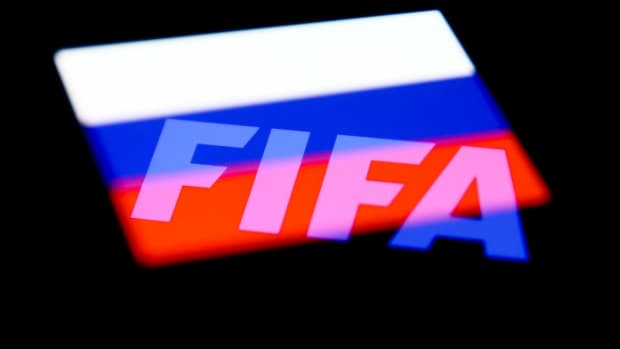 FIFA's logo and the Russian flag are seen displayed on a phone screen