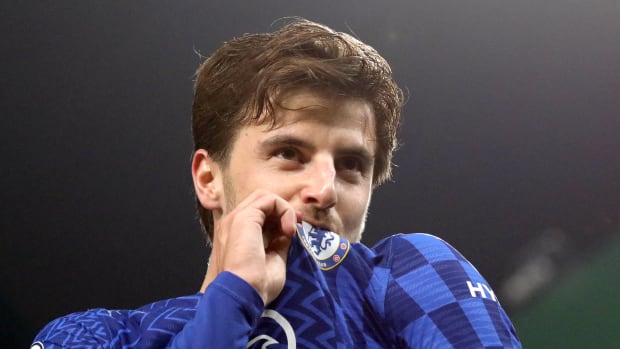 Mason Mount kisses the Chelsea badge after scoring a goal in their 3-1 win at Norwich