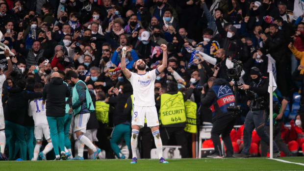 Karim Benzema celebrates scoring the winning goal for Real Madrid in their Champions League last 16 clash with PSG