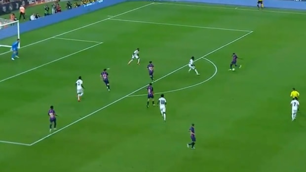 Raphinha pictured shooting to score a brilliant goal for Barcelona against Real Madrid in his first ever Clasico in July 2022