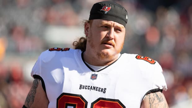 Buccaneers center Ryan Jensen without his helmet on during a game.