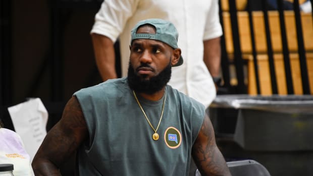 Basketball great LeBron James sits on the sidelines during The Skill Factory and Strive for Greatness game at the Peach Jam in North Augusta, S.C., on Thursday, July 21, 2022. TSF defeated Strive for Greatness 65-50. Sports Peach Jam The Skill Factory V Strive For Greatness