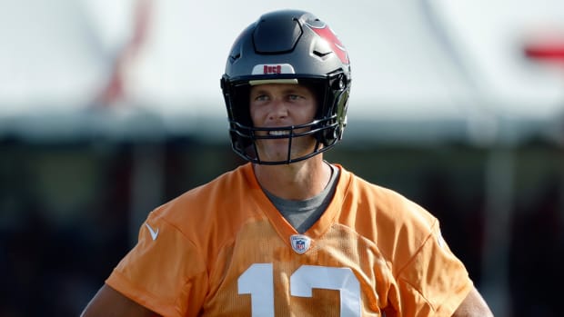 Tampa Bay Buccaneers quarterback Tom Brady (12) looks on during training camp.