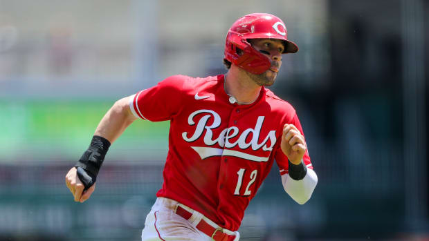 May 29, 2022; Cincinnati, Ohio, USA; Cincinnati Reds right fielder Tyler Naquin (12) scores on a double hit by first baseman Joey Votto (not pictured) in the sixth inning against the San Francisco Giants at Great American Ball Park.