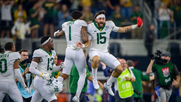 Dec 4, 2021; Arlington, TX, USA; Baylor Bears running back Trestan Ebner (1) and wide receiver Tripp Mitchell (15) celebrate the fourth down stop against the Oklahoma State Cowboys to win the Big 12 Conference championship game at AT&T Stadium.