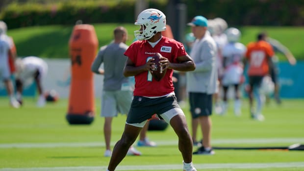 Jul 28, 2022; Miami Gardens, FL, USA; Miami Dolphins quarterback Tua Tagovailoa (1) runs a drill during training camp at Baptist Health Training Complex.