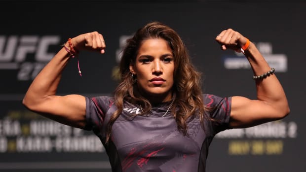 Julianna Pena steps on the scale for the ceremonial weigh-in at American Airlines Center for UFC 277